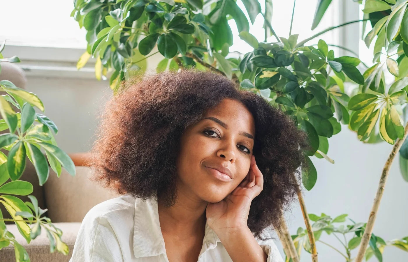 Women smiling with houseplants in the background